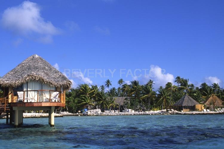 Islands;huts;ocean;palm trees;blue;water;sky;manihi;french polynesia